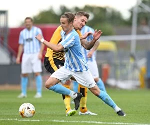 Images Dated 28th July 2015: Clash of Stars: James Maddison vs Barry Corr at Abbey Stadium - Coventry City vs Cambridge United
