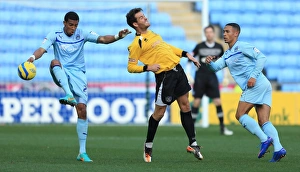 Images Dated 2012 November: Clash of the Titans: Jordan Clarke vs Chris Dillon - Coventry City vs Arlesey Town FA Cup Match