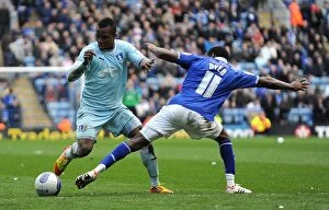 03-03-2012 v Leicester City, The King Power Stadium Collection: Clash of the Titans: Lloyd Dyer vs Alex Nimely in the Intense Npower Championship Showdown at The