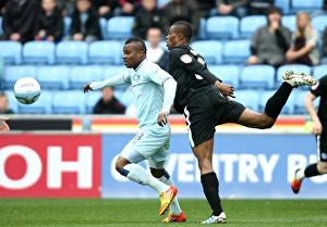 07-04-2012 V Peterborough United, Ricoh Arena Prints: Clash of Titans: Nimely vs. Zakuani in Coventry City vs