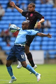 Images Dated 2nd August 2009: Clinton Morrison vs. Jack Rodwell: Intense Battle for the Ball in Coventry City's Pre-Season