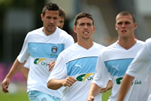 Prints of Coventry Citys Cody McDonald (centre) during the warm up Season 2012-13 Prints: Cody McDonald of Coventry City Gears Up for Pre-Season Friendly Against Bristol Rovers