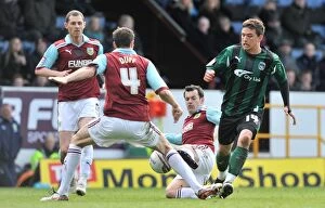 Images Dated 14th April 2012: Cody McDonald's Fierce Battle Against Burnley's Defenders: Coventry City vs Burnley