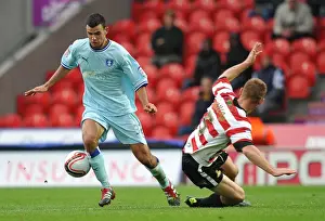 Images Dated 2011: Conor Thomas Dodges Richard Naylor's Challenge: Coventry City vs Doncaster Rovers