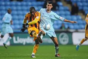 Images Dated 10th December 2011: Conor Thomas vs. Aaron McLean: Intense Clash in Coventry City vs