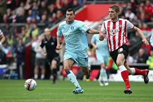 28-04-2012 V Southampton, St. Mary's Prints: Conor Thomas vs. Jos Hooiveld: A Championship Showdown of Power and Control at St