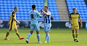 Images Dated 11th April 2015: Coventry City FC: Grant Ward and John Fleck's Jubilant Moment as Sky Bet League One Promotion is