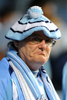 Images Dated 27th September 2011: Coventry City FC: A Passionate Fan Amidst the Action - Coventry City vs Blackpool