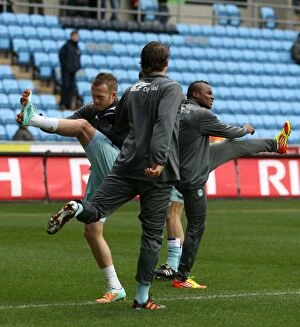 Images Dated 21st January 2012: Coventry City FC: Sammy Clingan and Alex Nimely Preparing for Action during Warm-Up at Ricoh Arena