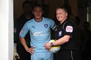 17-03-2012 v Watford, Vicarage Road Collection: Coventry City FC: Sammy Clingan and Referee Colin Webster Sharing a Light-Hearted Moment in