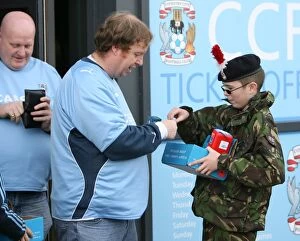 Images Dated 31st October 2009: Coventry City FC vs Reading in the Championship: Fans Honor Remembrance Day with Poppies at Ricoh