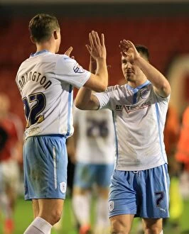 FA Cup - Third Round - Walsall v Coventry City - Bescot Stadium Collection: Coventry City FC's FA Cup Upset: Matthew Pennington and John Fleck Celebrate Over Walsall at