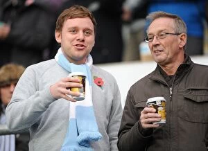 Images Dated 5th November 2011: Coventry City Football Club: A Cozy Npower Championship Moment - Fans Savoring Hot Drinks at Ricoh