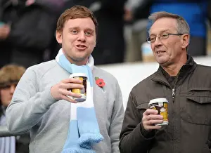 Fan Prints: Coventry City Football Club: A Cozy Npower Championship Moment - Fans Savoring Hot Drinks at Ricoh Arena