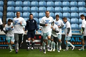 Images Dated 7th April 2012: Coventry City Players Warm Up in Know the Score T-Shirts before Npower Championship Match