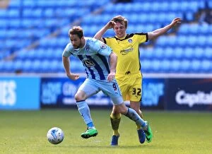 Images Dated 11th April 2015: Coventry City sNick Proschwitz (left) and Colchester Uniteds Tom Lapslie battle for the ball