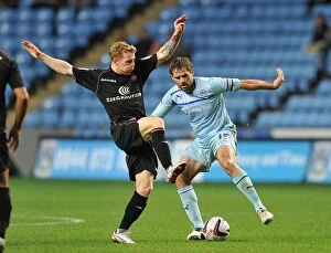 Images Dated 28th August 2012: Coventry City vs Birmingham City: A Battle for the Ball - Capital One Cup Rivalry