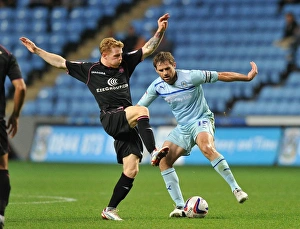 Images Dated 2012 August: Coventry City vs Birmingham City: A Battle for the Ball - Capital One Cup Rivalry