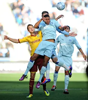 Images Dated 2011 October: Coventry City vs Burnley: Cyrus Christie Wins a Header in Npower Championship Match at Ricoh Arena (2011)