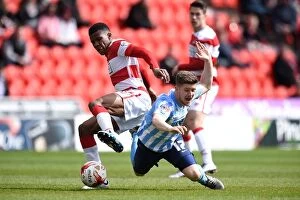 Images Dated 23rd April 2016: Coventry City vs Doncaster Rovers: Aaron Phillips Tumble in Sky Bet League One Clash at Keepmoat