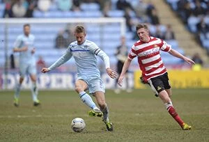 Images Dated 29th March 2013: Coventry City vs Doncaster Rovers: A Battle in Npower Football League One - Carl Baker vs John