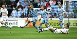 Prints of Coventrys Leon Mackenzie skips away from the challenge of Hulls Ian Ashbee during the Coca-Cola Football League Championship match at Ricoh Arena, Coventry Coca-Cola Football League Prints: Coventry City vs Hull City: Leon Mackenzie Evades Ian Ashbee in Championship Clash at Ricoh Arena