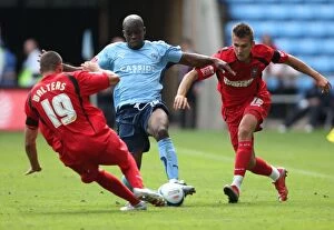 Images Dated 9th August 2009: Coventry City vs Ipswich Town: Intense Battle for the Ball in the Championship
