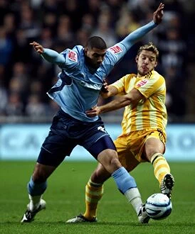 Images Dated 9th December 2009: Coventry City vs Newcastle United: A Championship Battle - Leon Best vs Alan Smith at Ricoh Arena