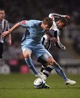 Images Dated 2010 February: Coventry City vs Newcastle United: Martin Cranie vs Wayne Routledge - Championship Battle at St