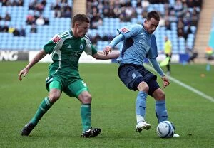 Images Dated 12th December 2009: Coventry City vs. Peterborough United: Championship Clash at Ricoh Arena - McIndoe vs