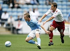 Images Dated 7th August 2010: Coventry City vs Portsmouth: A Battle in the Npower Championship (07-08-2010)