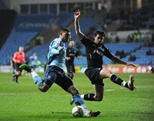 Images Dated 12th January 2010: Coventry City vs Portsmouth: FA Cup Third Round Replay Showdown - Leon Best vs Marc Wilson at