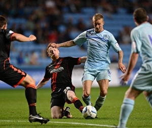 Images Dated 2012 August: Coventry City vs Sheffield United: Clash at Ricoh Arena - Carl Baker vs Stephen Quinn: Intense Battle