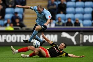 Images Dated 2nd May 2010: Coventry City vs. Watford: Battle for the Ball - Stephen Wright Leaps Clear of Don Cowie