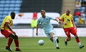 Images Dated 20th August 2011: Coventry City vs. Watford: Carl Baker Tackles Watford's Defense in Npower Championship Match