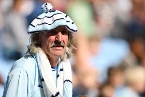 Images Dated 20th August 2011: Coventry City vs. Watford: Intense Moment at Ricoh Arena - A Fan's Passion