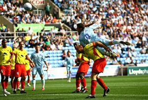 Images Dated 20th August 2011: Coventry City vs Watford: Lukas Jutkiewicz's Determined Header at Ricoh Arena