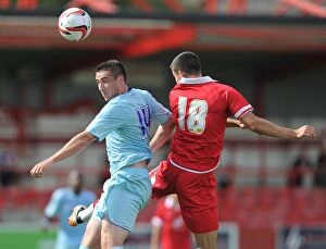 Images Dated 4th August 2012: Coventry City's Callum Ball Soars Over Accrington Stanley's Tom Eckersley (Pre-Season Friendly)