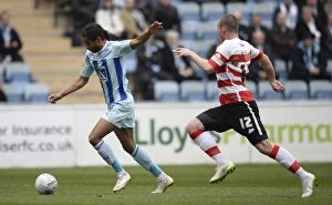 Images Dated 21st March 2015: Coventry Citys Dominic Samuel scores the opening goal against Doncaster Rovers