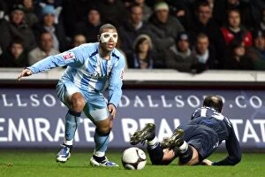 Images Dated 24th February 2009: Coventry City's Leon Best Evades Zurab Khizanshvili in FA Cup Fifth Round Replay