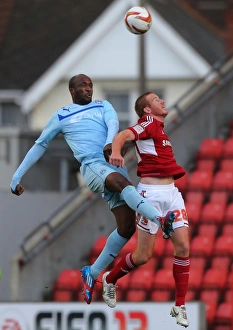 Images Dated 2012 October: Coventry City's Nathan Cameron Outjumps Swindon Town's Adam Rooney: A Head-to-Head Battle in Npower League One