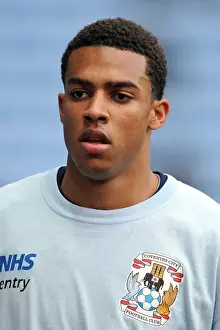 Images Dated 2011 December: Cyrus Christie vs Brighton & Hove Albion: Npower Championship Showdown at Ricoh Arena (December 31)