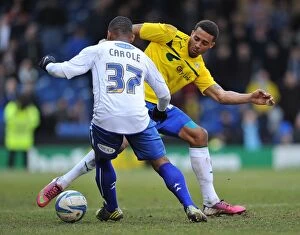 Images Dated 16th February 2013: Cyrus Christie vs Sebastien Carole: Intense Tackle in Coventry City vs Bury Npower League One