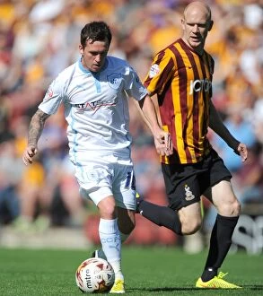 Images Dated 9th August 2014: Danny Swanson vs Bradford City: Intense Face-Off in Sky Bet League One Clash at Valley Parade