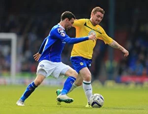 Images Dated 21st April 2014: David Worrall vs. John Fleck: A Riveting Rivalry in Oldham Athletic vs