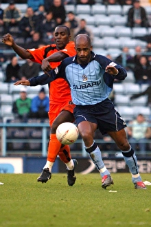 Images Dated 2004: Dean Gordon vs Wayne Andrews: Coventry City vs Colchester United FA Cup Fourth Round Clash (2004) - Shielding Battle