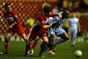 Images Dated 2006: Dele Adebola vs. Chris Riggott: Coventry City's FA Cup Battle at Middlesbrough (08-02-2006)