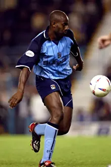 Images Dated 2003: Determined Dele Adebola: Coventry City's Battle Against Nottingham Forest (2003)