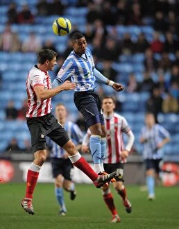 Images Dated 7th January 2012: FA Cup Third Round Showdown: Shaun Jeffers vs Aaron Martin - Coventry City vs Southampton
