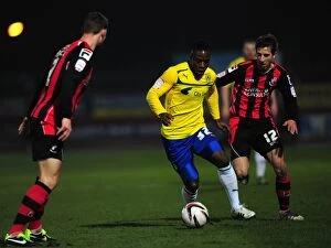 Images Dated 26th February 2013: Franck Moussa Evasions: Coventry City's Midfielder Escapes Wes Fogden at AFC Bournemouth